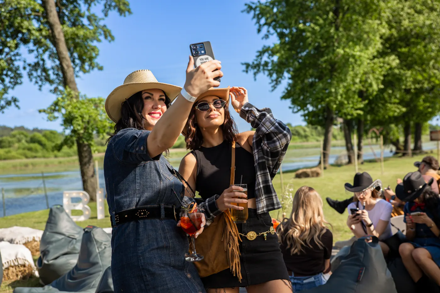 Two teammates taking a selfie at the lakeside Summer Camp 2025