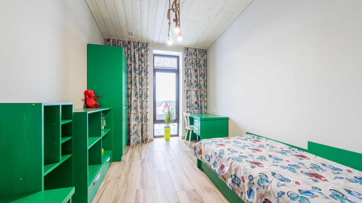 A child's room furnished with a coordinated furniture set